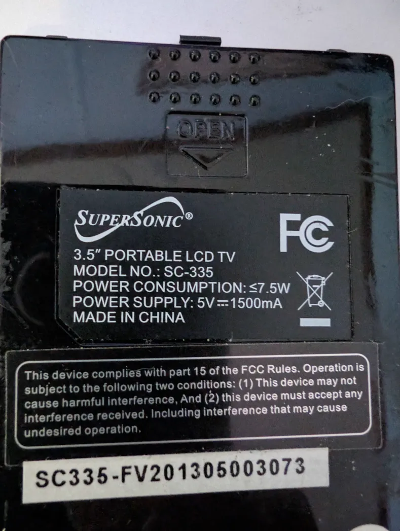 Info panel on the TV itself.  Specifications are:

Power Consumption ≤7.5W
Power Supply: 5V☴1500mA